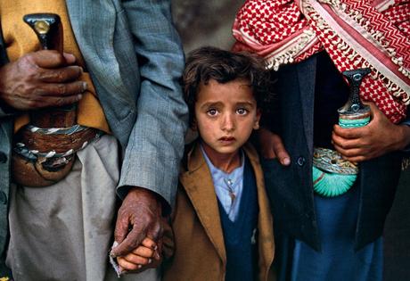 Child with relatives, Yemen